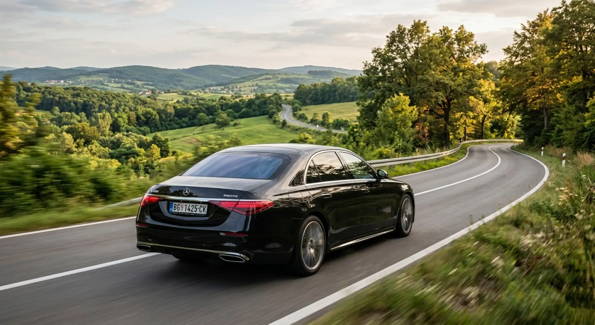 Private spa transfer Serbia — Mercedes S-Class on scenic road to Vrnjačka Banja